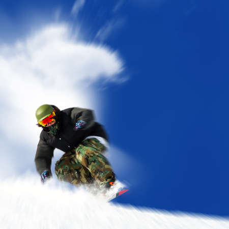 downhill with snowboards in fresh snowの写真素材