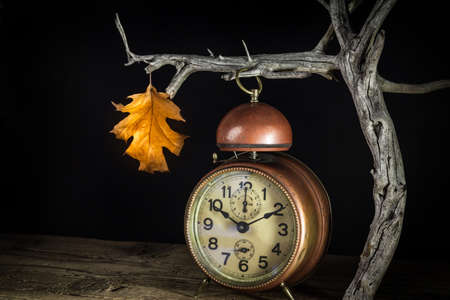 clock in autumn time - close upの写真素材