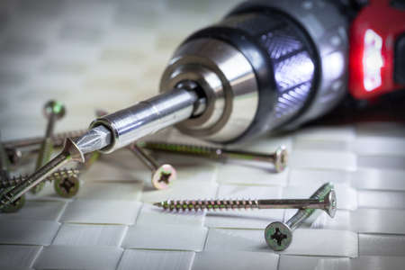 Cross screws with screwdriver - close upの写真素材