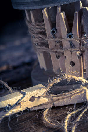 Spool with wooden pegs close upの写真素材