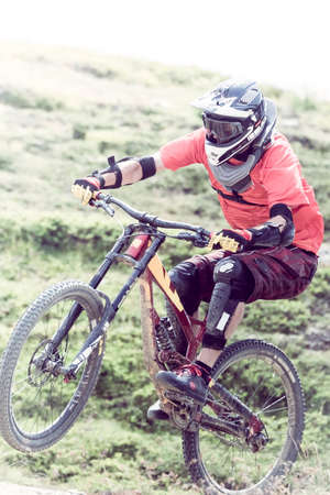 acrobatic jump with mtb on the moutainsの写真素材