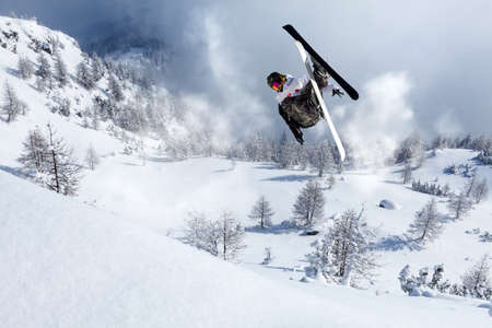 acrobatic freestyle jump on skisの写真素材