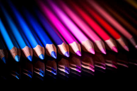 colored pencils on black backgroundの写真素材
