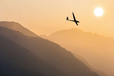 glider in 
fly into the Sunの写真素材