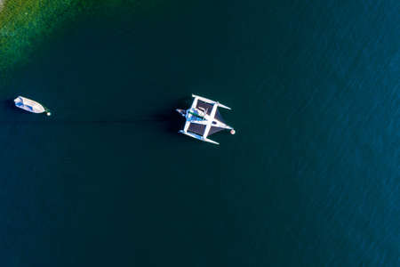 Moored catamaran - vertical aerial viewの写真素材