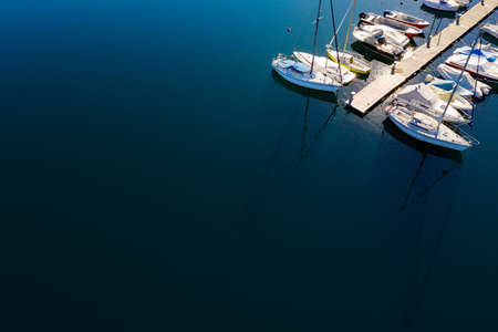 Moored sailboats and pleasure boats, aerial viewの写真素材