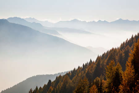 Valtellina (IT), Autumn view with mistの写真素材