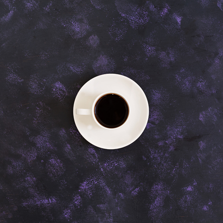 Cup of coffee on dark background. Top viewの写真素材