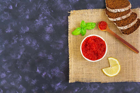 Red caviar on dark background. Top view.の写真素材