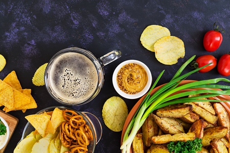 Baked potato wedges with sausages and spices. Top viewの写真素材