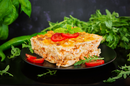 Classic Lasagna with bolognese sauce on dark backgroundの写真素材