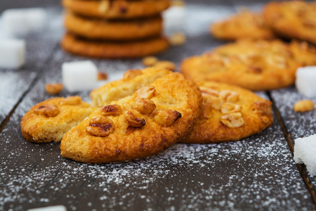 Cookies with peanuts on dark wooden backgroundの写真素材