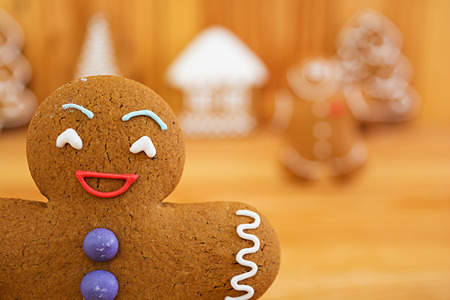 Christmas gingerbread cookies on wooden backgroundの写真素材