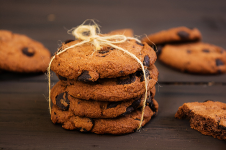 Cookies with chocolate on dark wooden backgroundの写真素材