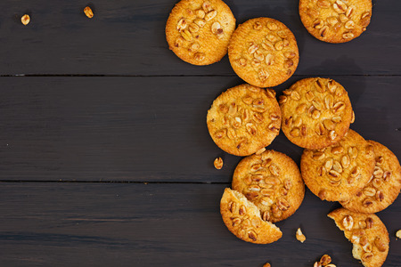 Cookies with peanuts on dark wooden backgroundの写真素材
