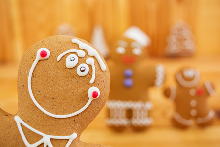 Christmas gingerbread cookies on wooden backgroundの写真素材