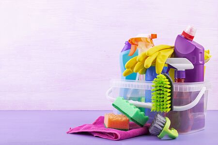 Cleaning service concept. Colorful cleaning set for different surfaces in kitchen, bathroom and...