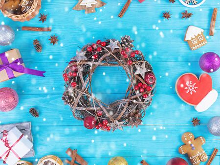 Christmas background. Christmas gift, toys, gingerbread cookies, spices and decorations on wooden background. Top viewの写真素材