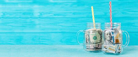 Business concept. Money in jar. Crisis, devaluation, save money.の写真素材