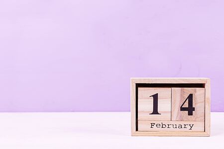 Valentine day. Wooden calendar with February 14 on it.