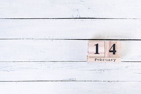 Valentine day. Wooden calendar with February 14 on it.の写真素材