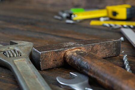 Set of working tools on wooden rustic background. Top view. Copy space