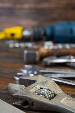 Set of working tools on wooden rustic background