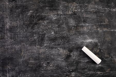 Background of dirty chalkboard. Empty school blackboard.の写真素材