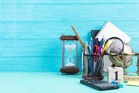 Different school supplies on blue background. Concept Back to school