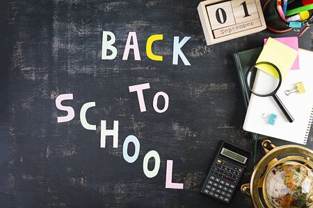 Different school supplies on dark background. Concept Back to schoolの写真素材