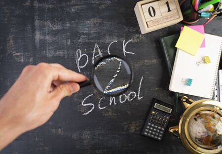Different school supplies on dark background. Concept Back to schoolの写真素材