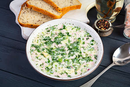 Russian traditional cold soup okroshka. Summer cold soup with yogurt and vegetables.の写真素材