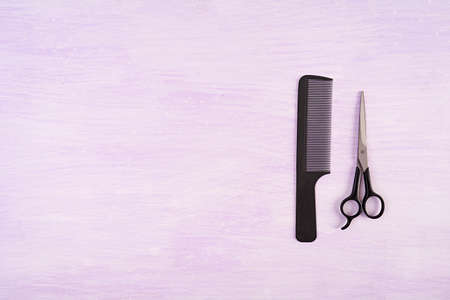 Hairdresser tools on wooden background. Haircut accessories concept. Top viewの写真素材