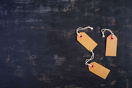 Blank label tag isolated on dark background. Price tag. Sale concept.の写真素材