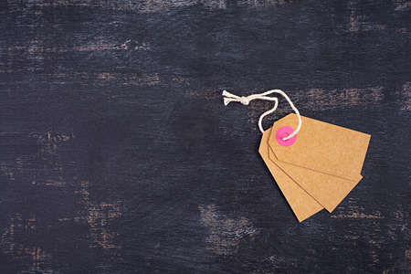 Blank label tag isolated on black background. Price tag. Sale concept.