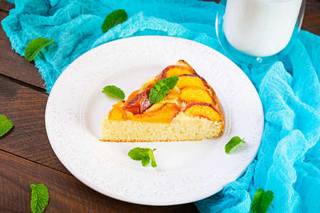 Delicious homemade peach pie on wooden backgroundの写真素材