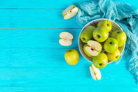 Ripe green apples on a wooden background. Delicious juicy applesの写真素材