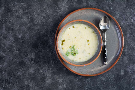 Delicious creamy beef soup. Vegetable creamy soup with beef, herbs and bread. Top view
