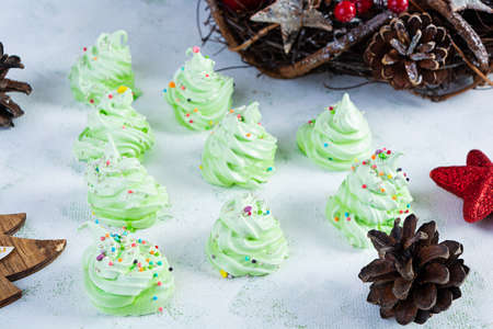 Meringue cookies with Christmas decoration. French dessert. Christmas tree of meringueの写真素材