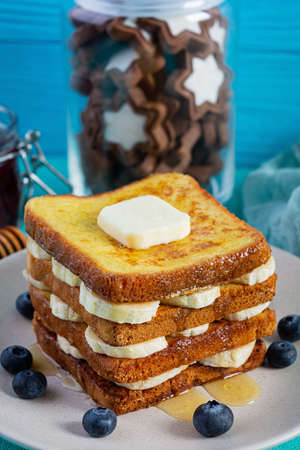 French toast with banana, blueberry, honey and strawberry jam. Delicious morning breakfast or brunch...