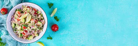 Vegetarian tabbouleh salad with couscous, parsley, cucumber, tomato. Traditional middle eastern or arabic cuisineの写真素材