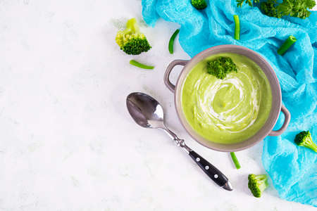 Vegetarian cream soup with broccoli and pea. Healthy diet lunch. top viewの写真素材
