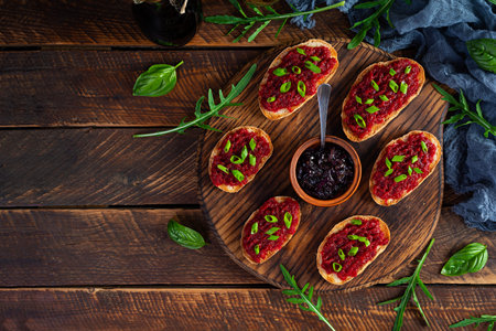 Bruschetta with grated beetroot, herbs and caramelized onion. top viewの写真素材