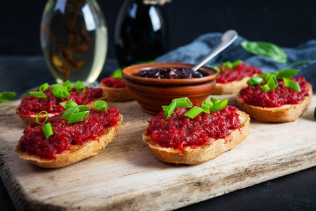 Bruschetta with grated beetroot, herbs and caramelized onionの写真素材