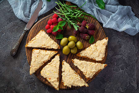 Toasts with chicken rillettes, olives and berries. Sandwich snack with chicken pate. top viewの写真素材