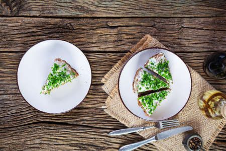 Liver cake on wooden background. Sliced layered liver cake with mayonnaiseの写真素材