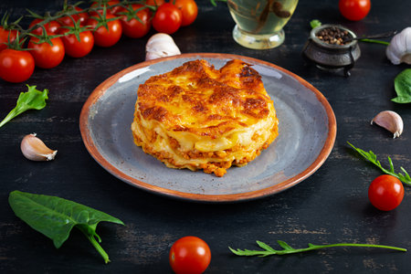 Classic lasagna with minced chiken bolognese sauce and bechamel sauceの写真素材