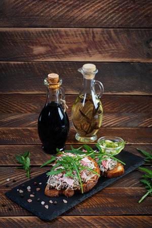 Roasted sandwiches with caramelized onion mixed with cream cheese and herbs. Grilled sandwichの写真素材