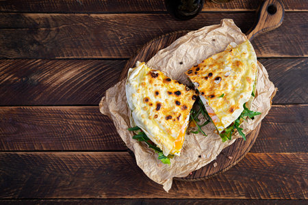 Grilled stuffed lavash with herbs, tomato and egg. Lavash sandwich