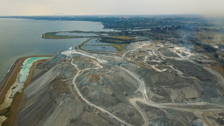 Aerial view. Slag storage on the coast. A place for the storage of the slag. Large slag mountains. Slag pitの写真素材